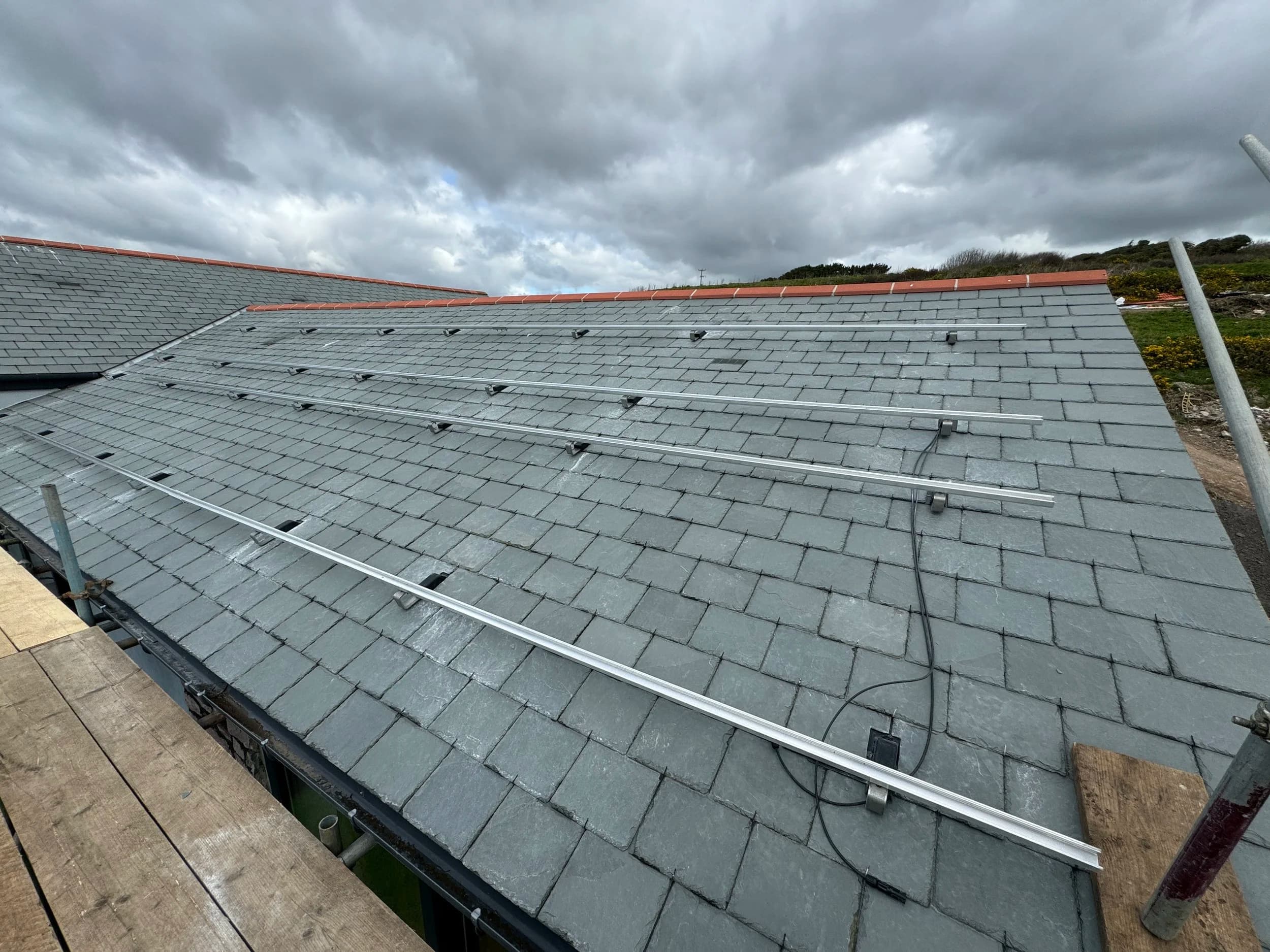 Mounting rails fixed to the slate roof at Thanckes House