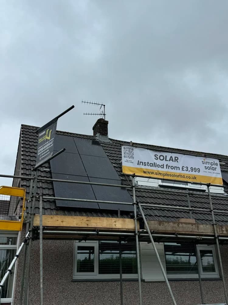 A solar panel installation on the roof of a residential property with scaffolding from Simple Solar Ltd.
