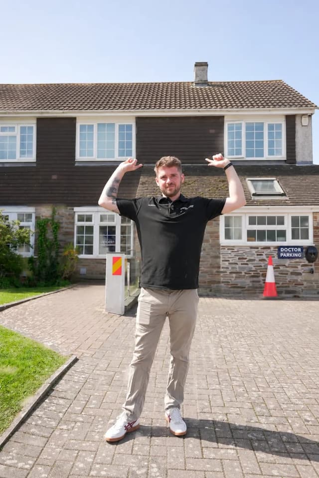 Dan from Simple Solar smiling outside a customer’s home.