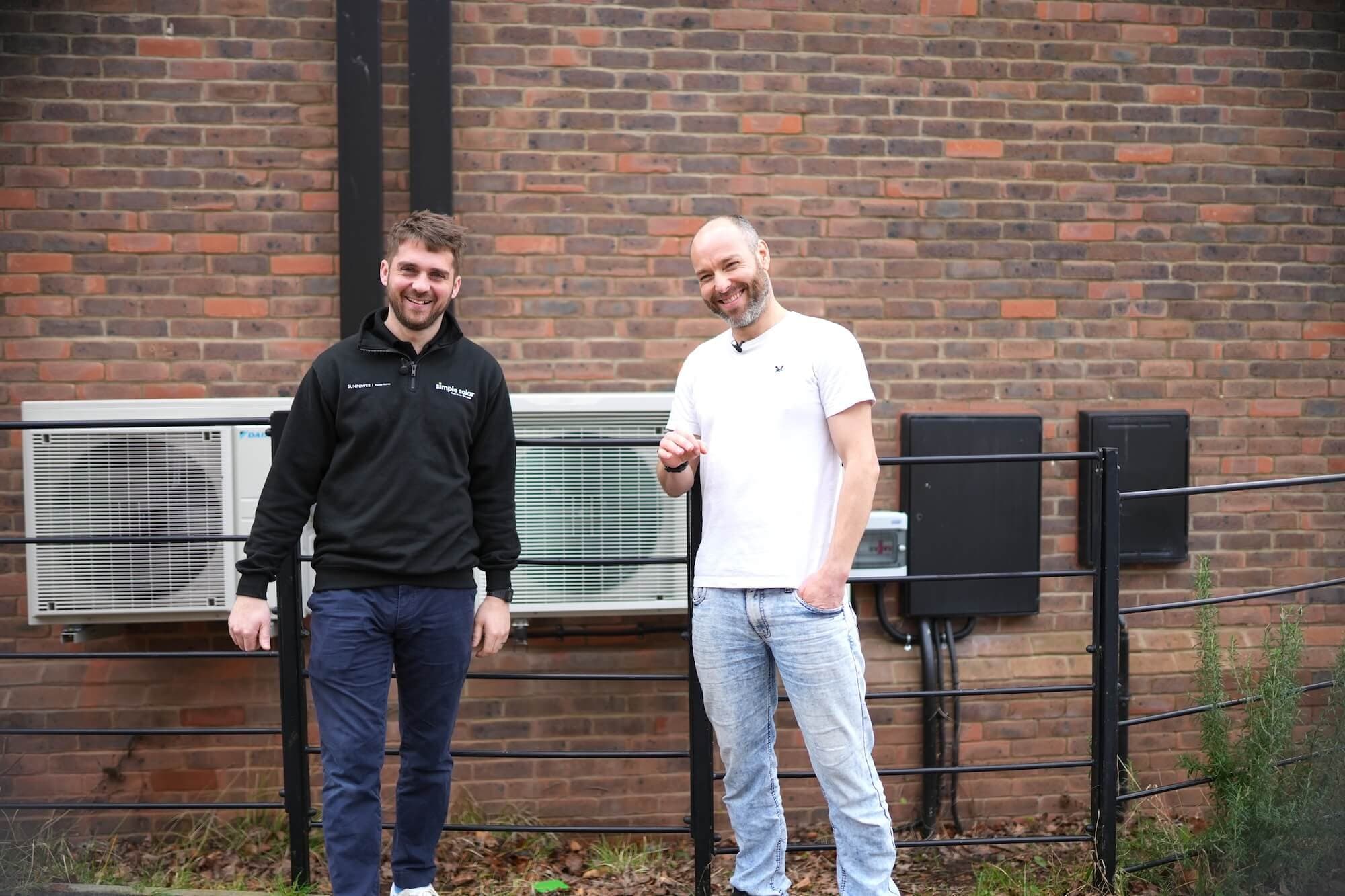 Heat pump installers working on an air source heat pump installation in Ivybridge.
