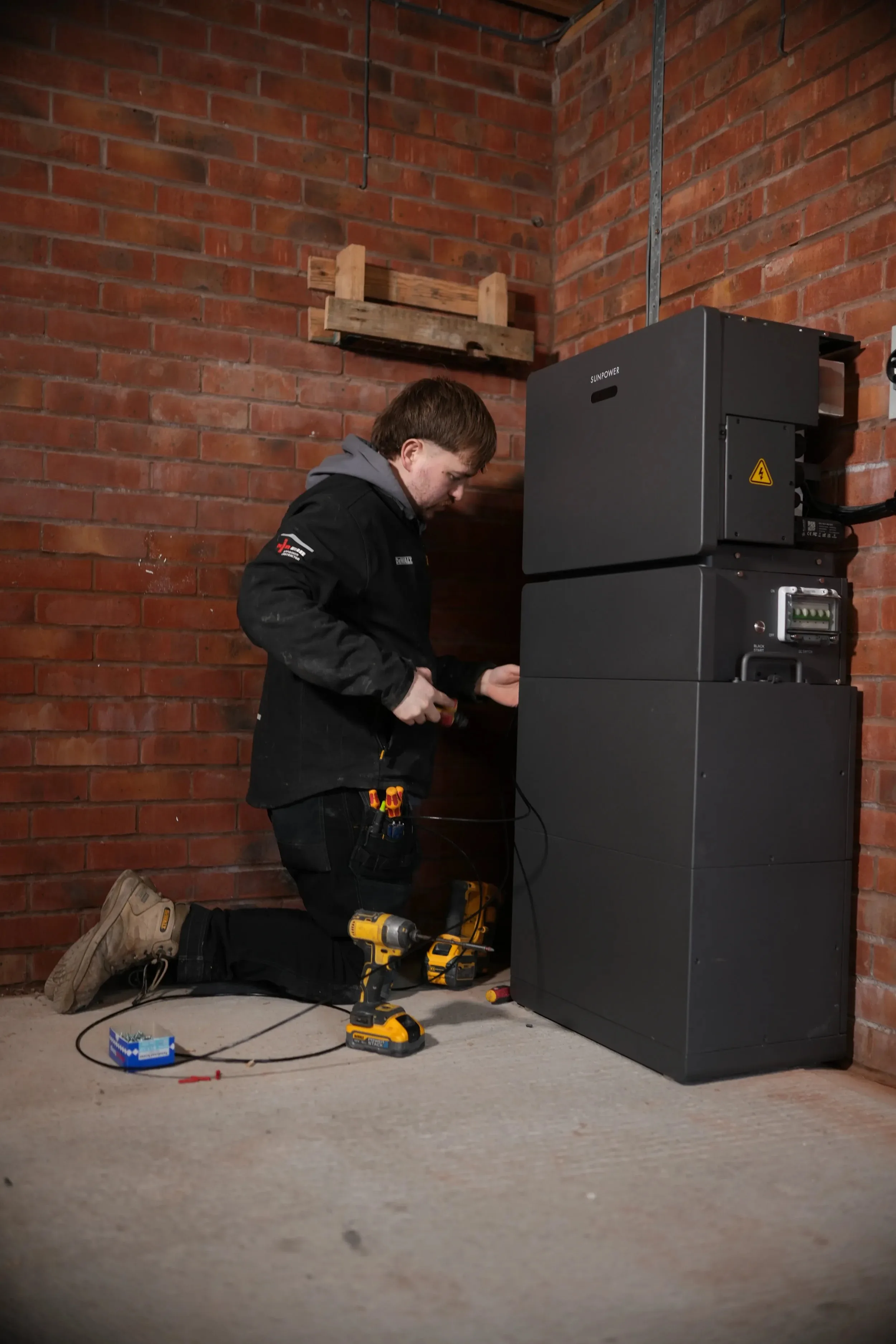 A Simple Solar electrician wiring a home battery storage system