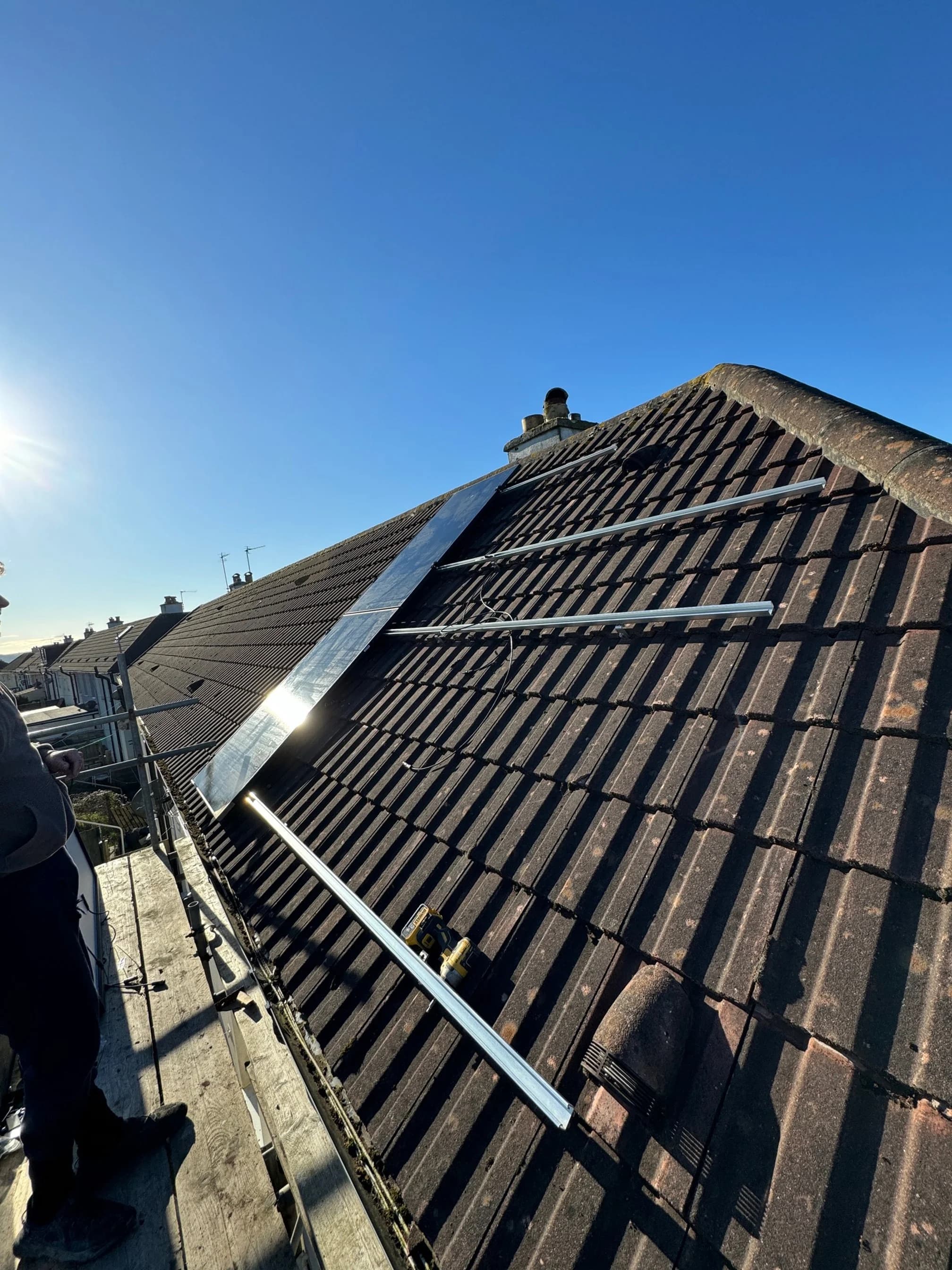 Mounting rails fitted to the tiled roof before the panels went on