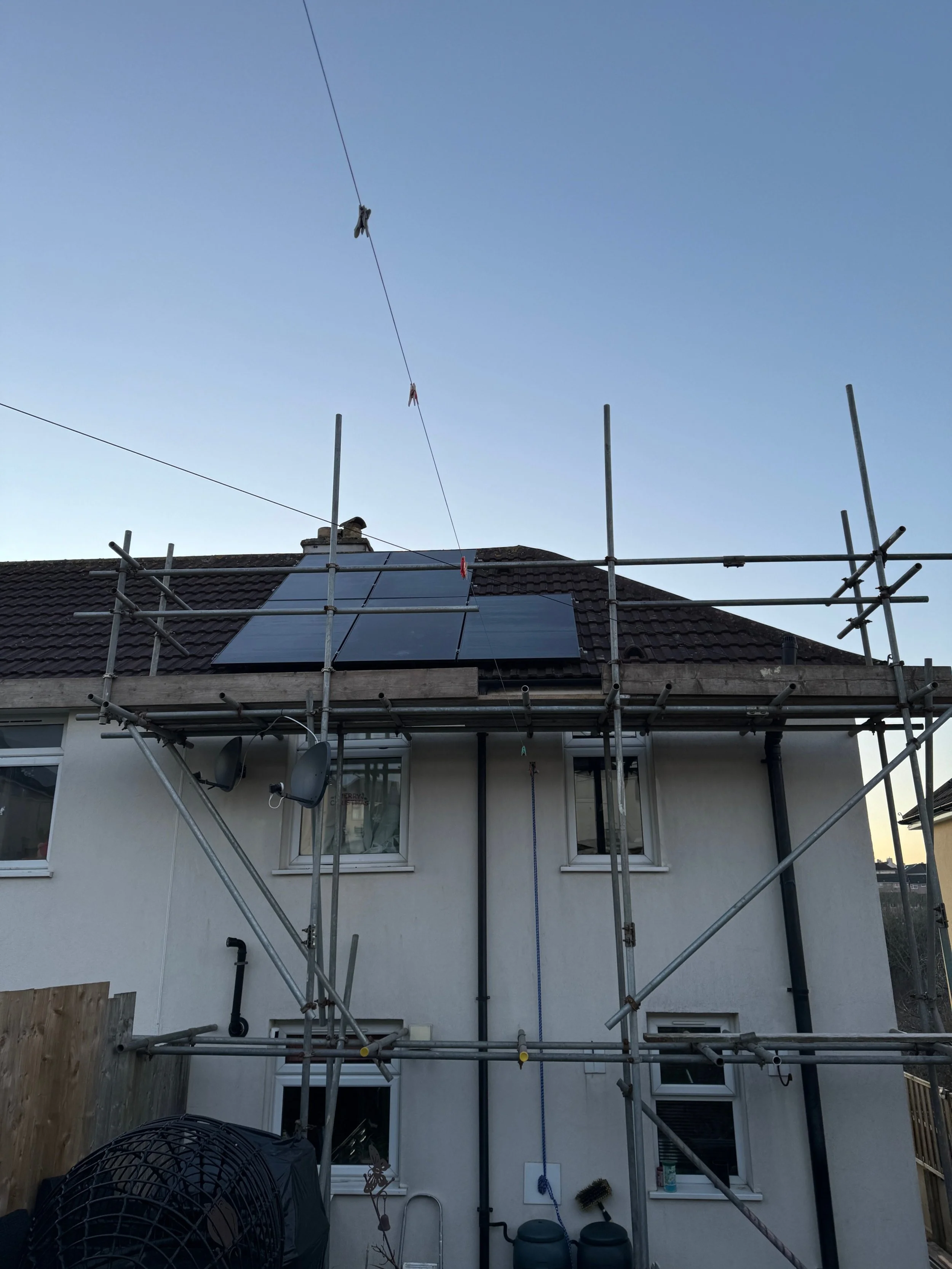 The house at Channel Park with scaffolding up and solar panels on the roof