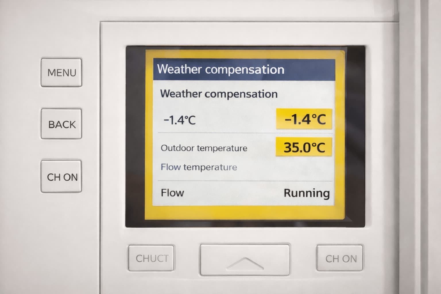A close-up of a modern heat pump controller screen showing temperature and settings, representing system controls and commissioning.